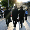 Three business men walking in Japan after work